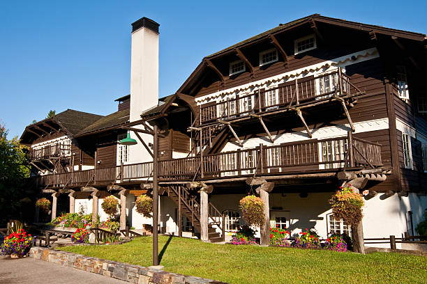 Historic Lake McDonald Lodge Lake McDonald Lodge is a historic hotel located on the southeast shore of Lake McDonald in Glacier National Park, Montana, USA. The lodge was built in 1913 and designated a National Historic Landmark in 1987. jeff goulden montana stock pictures, royalty-free photos & images