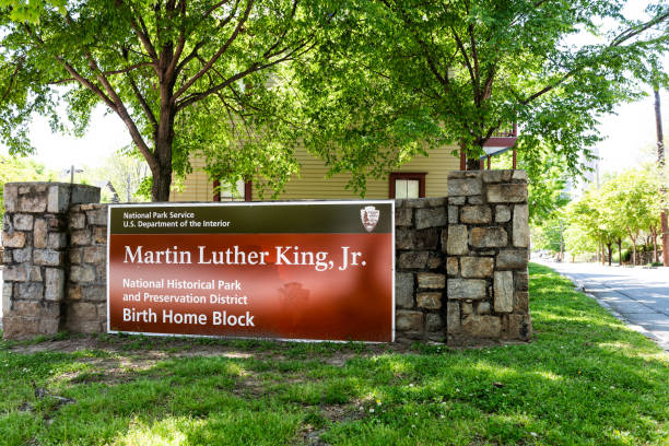Historic MLK Martin Luther King Jr National Park sign of birth home block in Georgia downtown, green trees in urban city Atlanta, USA - April 20, 2018: Historic MLK Martin Luther King Jr National Park sign of birth home block in Georgia downtown, green trees in urban city martin luther king jr photos stock pictures, royalty-free photos & images