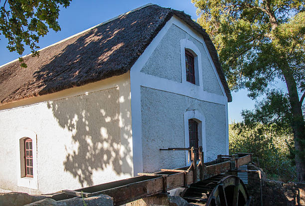 Historic water mill in mission village of Elim stock photo