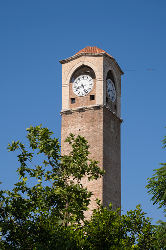 historical clock tower and blue sky background. buyuk saat. adana, turkey.