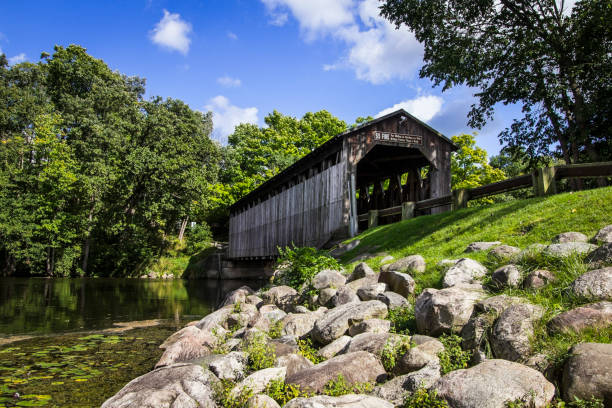 Historical Covered Bridge In Michigan Open To Auto Traffic The historic Fallasburg covered bridge in Michigan remains open to auto traffic and is located approximately twenty minutes from the city of Grand Rapids. covered bridge stock pictures, royalty-free photos & images