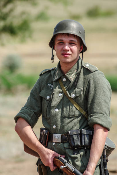 Historical reenactor in the uniform of a soldier of the German army during the Second World War stock photo