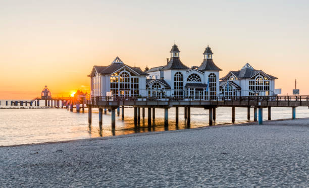 Historical Sellin pier on Ruegen island at sunrise Historical Sellin pier on Ruegen island at sunrise, Germany rügen stock pictures, royalty-free photos & images