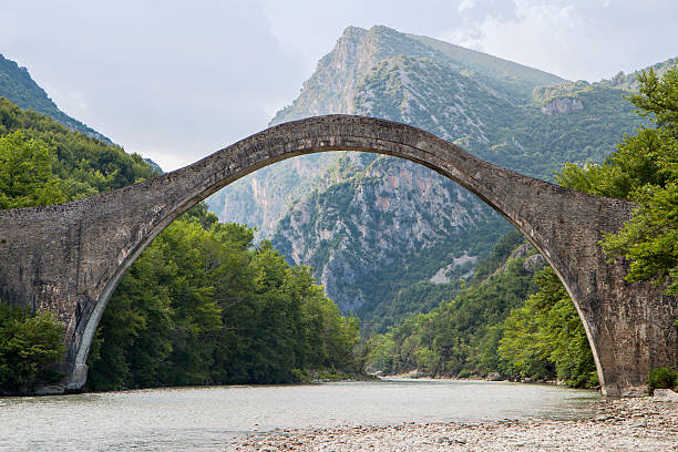 Historical stone bridge of Plaka at Epiros, Greece stock photo