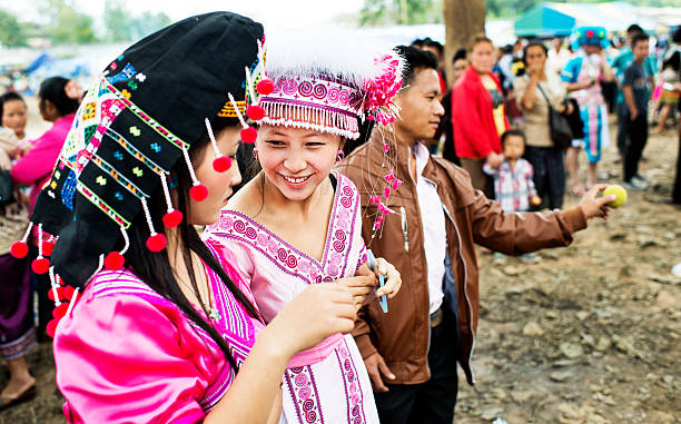 Hmong New Year Beauties Luang Prabang, Laos - December 15, 2012:  Homng young woman wearing traditional clothing at the new year festival. asian beauties stock pictures, royalty-free photos & images