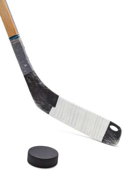 Hockey Puck and Stick Ice Hockey Stick with Black Puck Isolated on White Background. hockey stick stock pictures, royalty-free photos & images