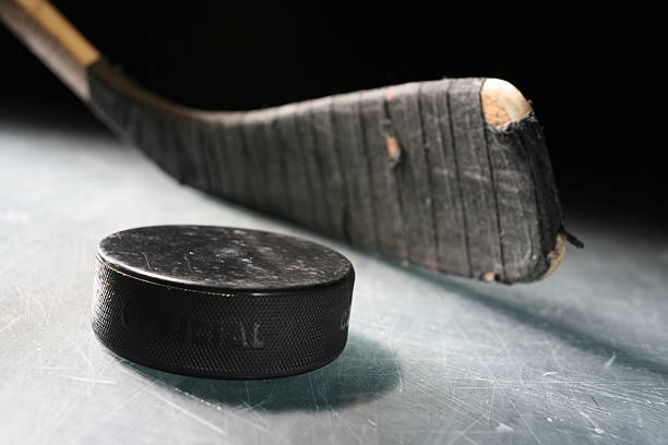 Hockey Stick & Puck  hockey stick stock pictures, royalty-free photos & images