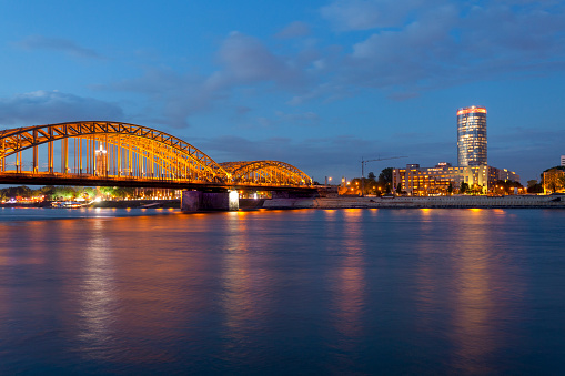 Hohenzollern Bridge and the Triangle Tower cityscape at night, Cologne, Germany