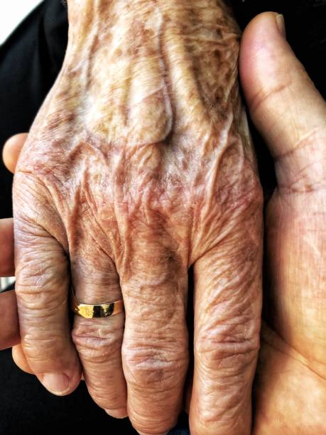 Holding a senior lady’s hand stock photo