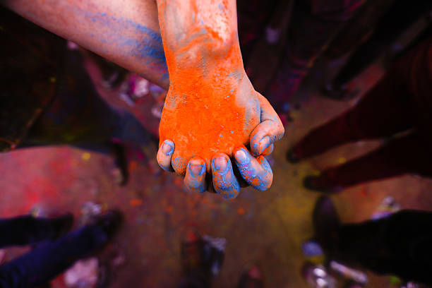 Holi festival hands with coloured powder stock photo