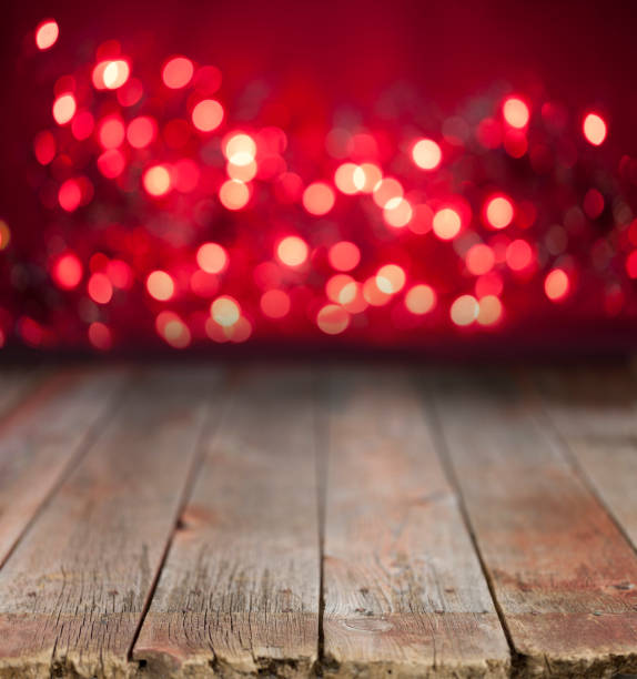Święto, Boże Narodzenie lub Walentynki-Specjalne Okazje Red Defocused Bokeh Światła na drewnie