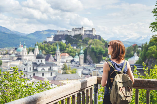 Holiday in Salzburg: Young girl is enjoying the view. Historic district, Festung Hohensalzburg stock photo