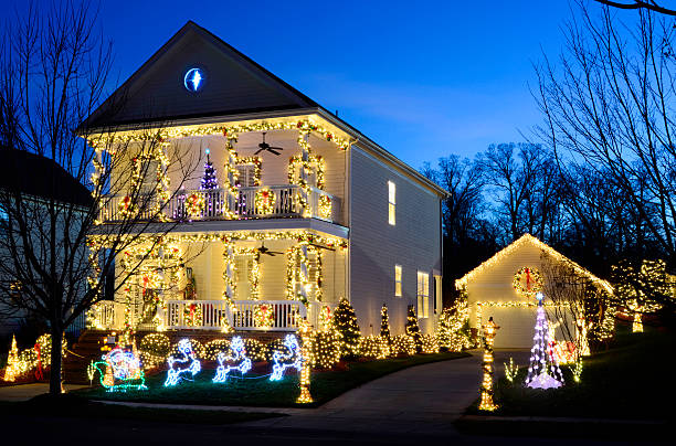 Holiday Lights This traditional, Victorian-style, wood-siding home is beautifully and tastefully decorated for the Holiday Season. Please view my portfolio for other Christmas Lights images. christmas lights house stock pictures, royalty-free photos & images