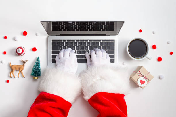Holiday online shopping theme with laptop Christmas theme with laptop computer and xmas ornaments from above online shopping photos stock pictures, royalty-free photos & images