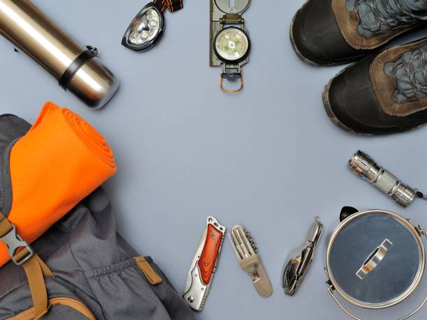 Holidays and Travel Equipment set on gray background. Athletic Life Style. Top view point. Flat lay. Equipment for a Travel. Athletic Life Style. scout camp stock pictures, royalty-free photos & images