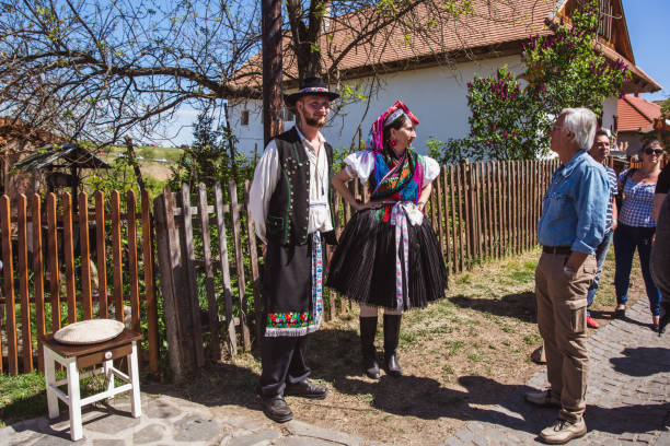 Holloko in Hungary HOLLOKO, HUNGARY - April 12, 2019: Easter festival in the folklore village of Holloko in Hungary. Villagers dressed in traditional costumes. The village is included in the UNESCO list of cultural values unesco organised group stock pictures, royalty-free photos & images