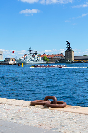 Copenhagen; Denmark - June 22, 2019 : Holmen naval base in Copenhagen, Frigate of Royal Danish Navy moored in the port, view from the waterfront