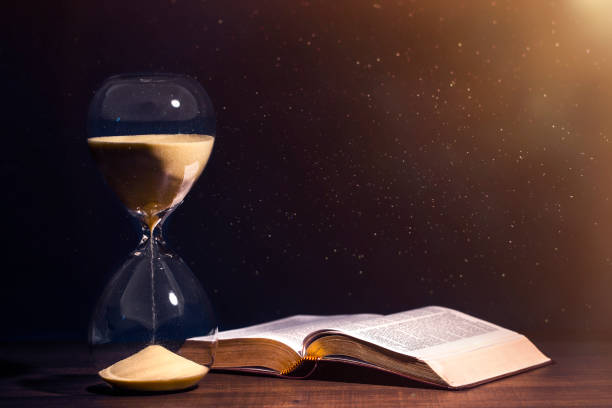 Holy Bible and Countdown Hourglass stock photo