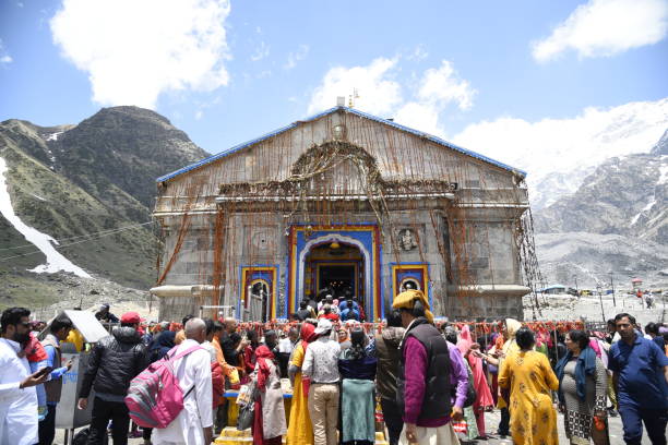 Holy Hindu Temple of Lord Shri Kedarnath Shankar Bholenath Temple 2019 view in Chamoli District , Uttrakhand , India , Asia Kēdārnāth Mandir (Kedarnath Temple) is a Hindu temple (shrine) dedicated to Lord Shiva. Located on the Garhwal Himalayan range near the Mandakini river, Kedarnath is located in the state of Uttarakhand, India. Due to extreme weather conditions, the temple is open to the general public only between the months of April (Akshaya Tritriya) and November (Kartik Purnima, the autumn full moon). During the winters, the vigrahas (deities) from Kedarnath temple are carried down to Ukhimath and where the deity is worshiped for the next six months. Kedarnath is seen as a homogenous form of Lord Shiva, the 'Lord of Kedar Khand', the historical name of the region.

The temple is not directly accessible by road and has to be reached by a 16 kilometres (9.9 mi) uphill trek from Gaurikund. Pony and manchan service is available to reach the structure. According to Hindu legends, the temple was initially built by Pandavas, and is one of the twelve Jyotirlingas, the holiest Hindu shrines of Shiva. It is one of the 275 Paadal Petra Sthalams, expounded in Tevaram. Pandavas were supposed to have pleased Shiva by doing penance in Kedarnath. The temple is one of the four major sites in India's Chota Char Dham pilgrimage of Northern Himalayas. This temple is the highest among the 12 Jyotirlingas. Kedarnath was the worst affected area during the 2013 flash floods in North India. The temple complex, surrounding areas, and Kedarnath town suffered extensive damage, but the temple structure did not suffer any "major" damage, apart from a few cracks on one side of the four walls which was caused by the flowing debris from the higher mountains. A large rock among the debris acted as a barrier, protecting the temple from the flood. The surrounding premises and other buildings in the market area were heavily damaged.[Content by Wikipedia] kedarnath temple stock pictures, royalty-free photos & images