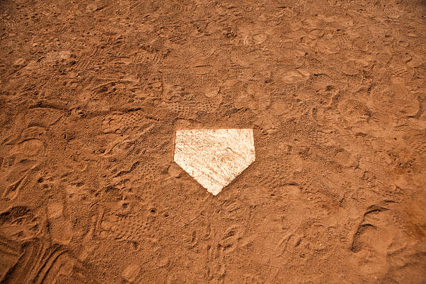 Home base plate on the diamond Baseball batters box in the dirt base sports equipment stock pictures, royalty-free photos & images