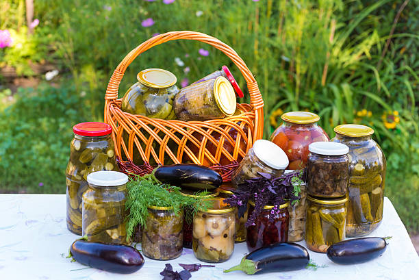 Home canning, canned vegetables outdoors stock photo