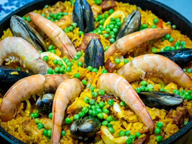 Home cooked Paella, complete with seafood and other ingredients. stock photo