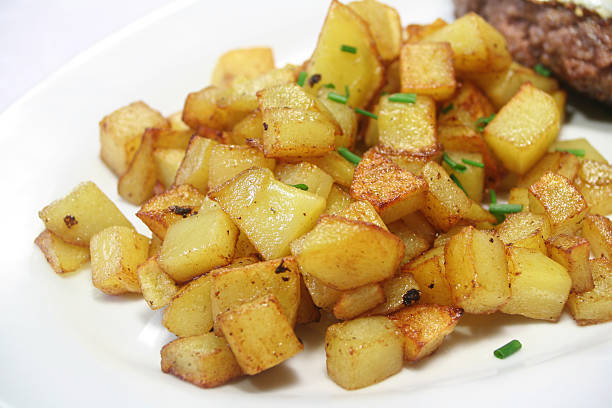 Home Fries closeup of fried potatoes hash brown photos stock pictures, royalty-free photos & images