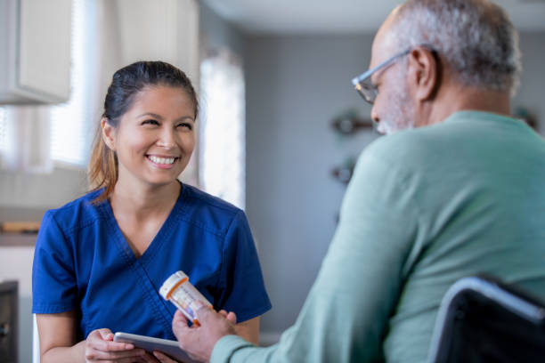 Home healthcare nurse brings new prescriptions for senior man Home healthcare nurse brings new prescriptions for senior man filipino ethnicity stock pictures, royalty-free photos & images