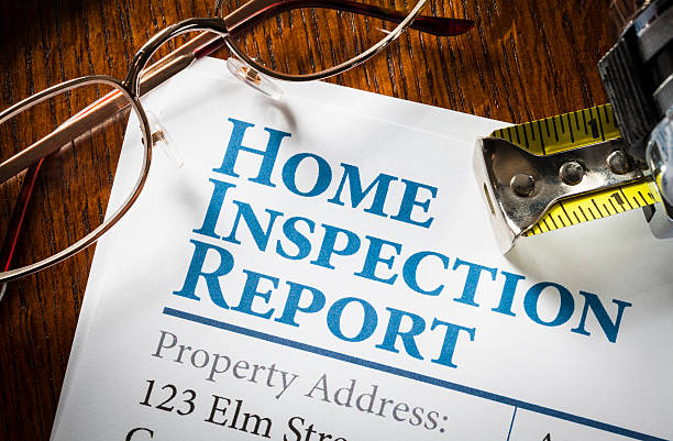 Home Inspection Report Home Inspection Report with measuring tape and glasses on desk home inspection stock pictures, royalty-free photos & images