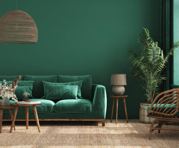 Home interior background with green sofa, table and decor in living room stock photo