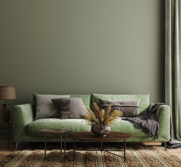 Home interior mock-up with green sofa, table and decor in living room stock photo