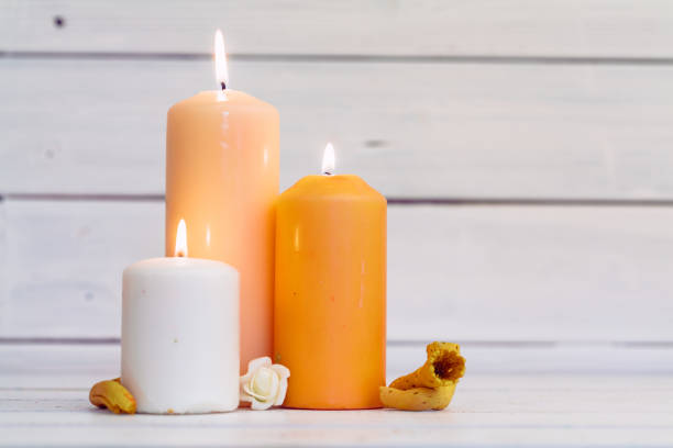 home lighting candles on wooden table stock photo