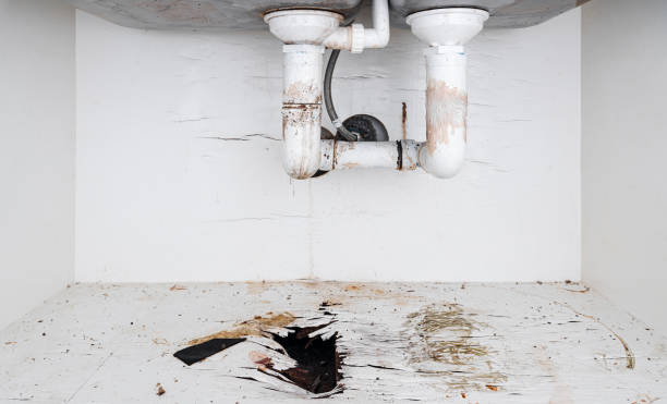 Home problems, Damaged water leak out from piping under sink in the kitchen stock photo