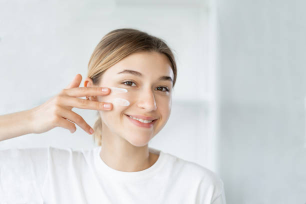 home skincare moisturizing cosmetology woman cream stock photo