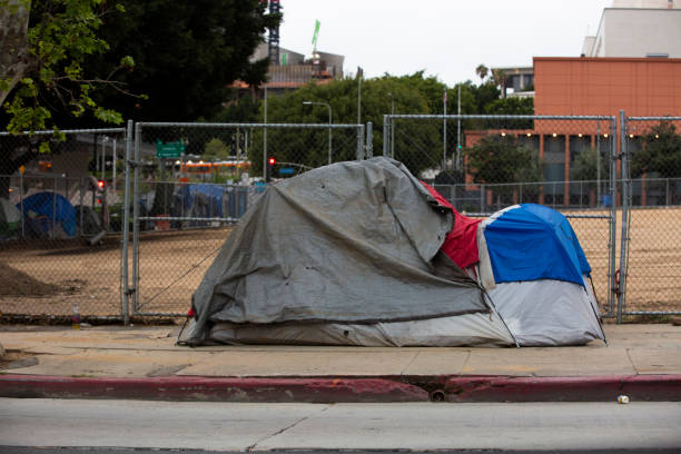 Homeless Sidewalk view of a homeless encampment in Downtown Los Angeles, California. homelessness stock pictures, royalty-free photos & images