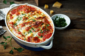 Homemade baked cannelloni with tomatoes and cheese
