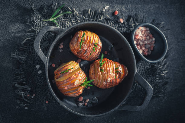 Homemade baked potatoes with herbs and oil. Swedish cuisine. stock photo