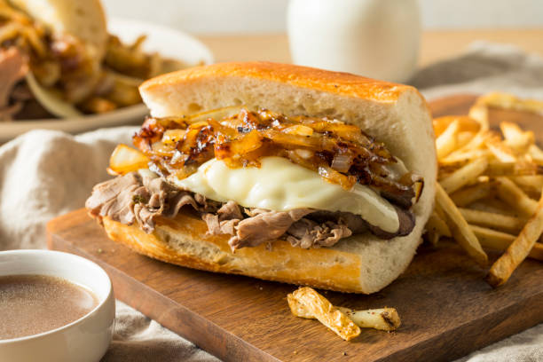 Homemade Beef French Dip Sandwich Homemade Beef French Dip Sandwich with French Fries roast beef sandwich stock pictures, royalty-free photos & images