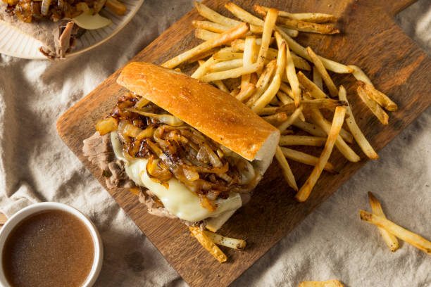 Homemade Beef French Dip Sandwich Homemade Beef French Dip Sandwich with French Fries roast beef sandwich stock pictures, royalty-free photos & images
