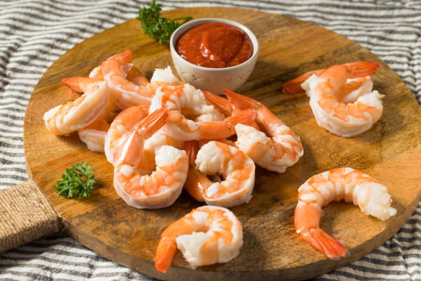 Homemade Boiled Shrimp Appetizer Homemade Boiled Shrimp Appetizer with Cocktail Sauce cocktail sauce stock pictures, royalty-free photos & images