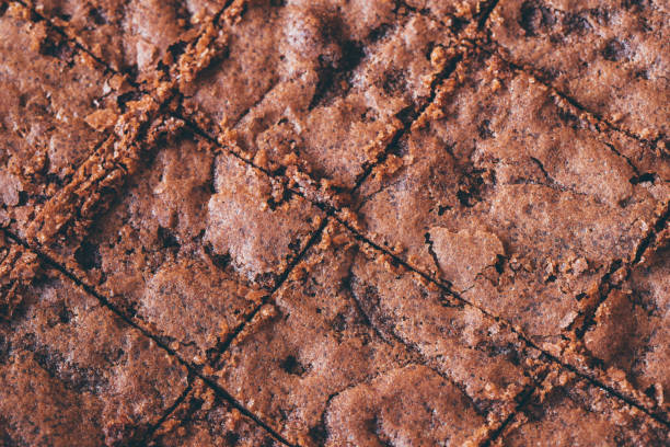 Homemade Brownies on the baking paper and the wooden table.  lepro stock pictures, royalty-free photos & images