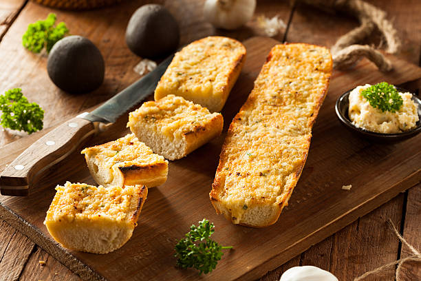 Homemade Cheesy Garlic Bread Homemade Cheesy Garlic Bread with Herbs and Spices garlic bread stock pictures, royalty-free photos & images