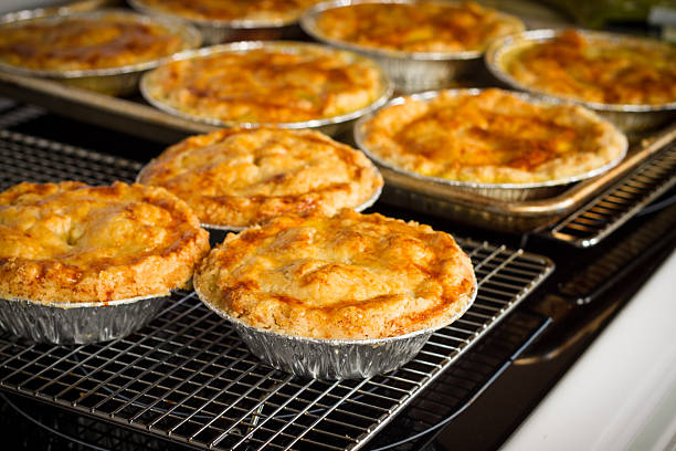 Homemade Chicken Pot Pies Cooling On Rack Homemade Chicken Pot Pies Cooling On Rack meat pie stock pictures, royalty-free photos & images