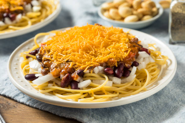Homemade Cincinnati Chili Spaghetti Homemade Cincinnati Chili Spaghetti with Cheese and Onion cincinnati stock pictures, royalty-free photos & images
