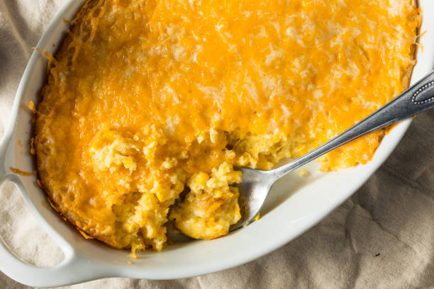 Homemade Corn Pudding Casserole Homemade Corn Pudding Casserole with Cheddar Cheese casserole stock pictures, royalty-free photos & images