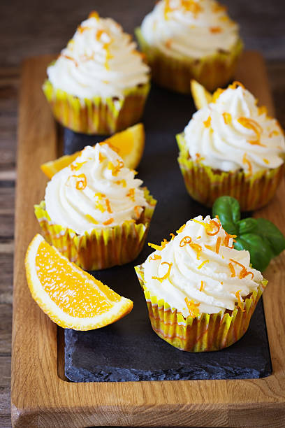 Homemade cupcakes with oranges stock photo