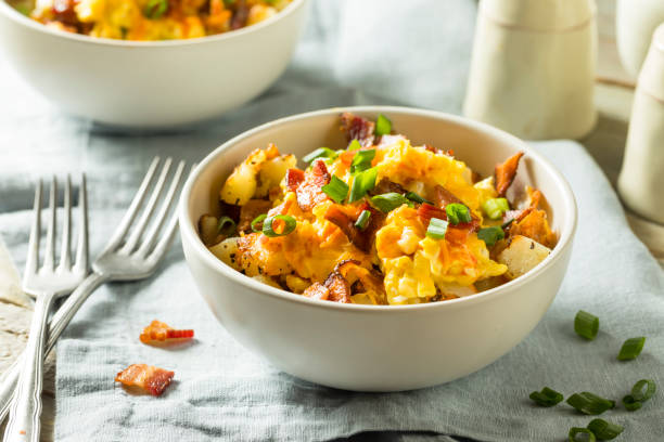 Homemade Egg and Potato Breakfast Bowl Homemade Egg and Potato Breakfast Bowl with Bacon hash brown photos stock pictures, royalty-free photos & images