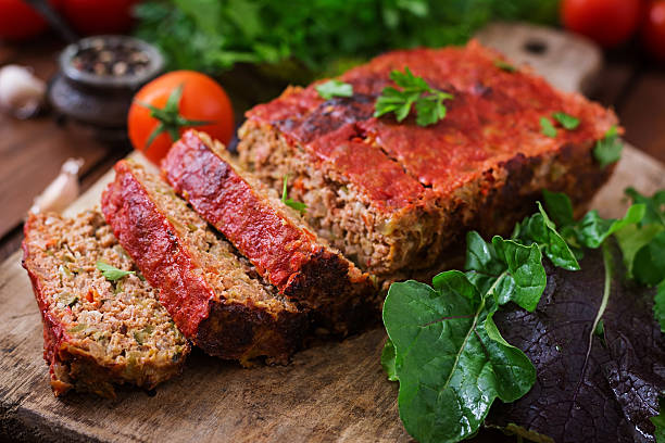 homemade ground meatloaf with vegetables. - meatloaf stockfoto's en -beelden