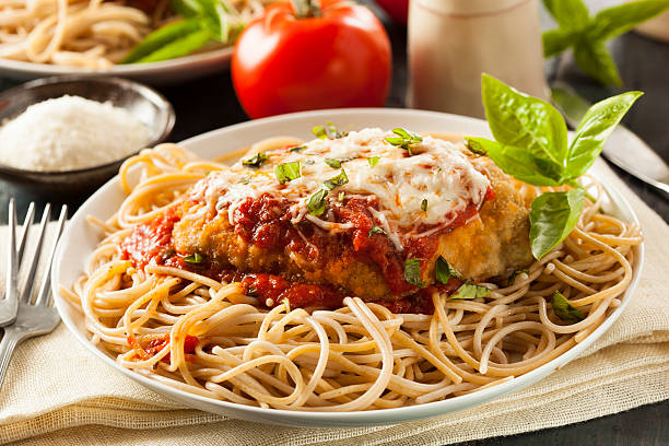 Homemade Italian Chicken Parmesan Homemade Italian Chicken Parmesan with Cheese and Sauce parmesan cheese stock pictures, royalty-free photos & images