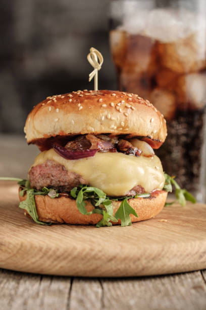 Homemade juicy cheeseburger with beef, cheese and caramelized onions. Street food, fast food stock photo